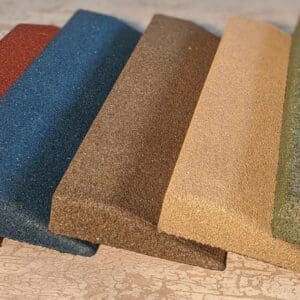 A group of different colored samples of carpet.