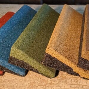 A group of different colored sponge on top of a table.